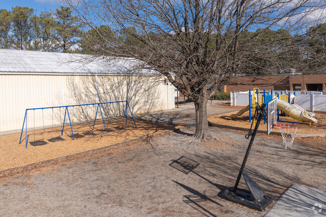 Head Elementary School FREE TRIAL EXPIRED has several playgrounds for the students to play on.
