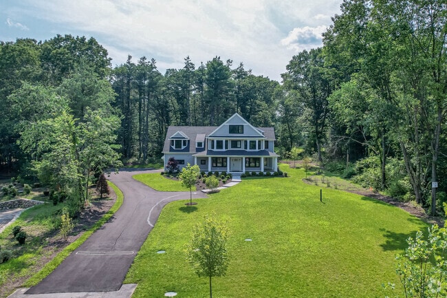 Colonial home with long private driveway in Lincoln.