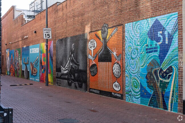 A public mural in an Atlas District alley is a celebration and commentary on social justice.