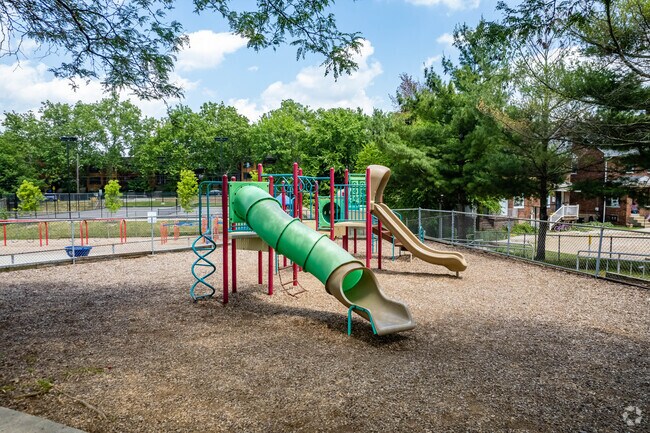 The playground includes slides and monkey bars at Lincoln Elementary School.