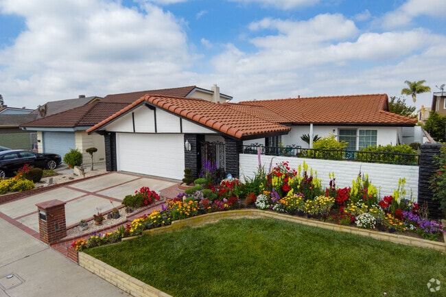 There are many homes with Spanish tile roofs and floral landscapes in La Palma.
