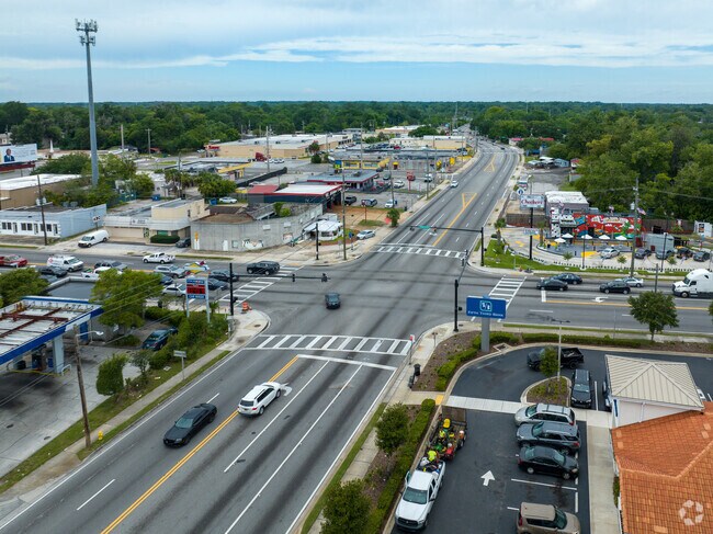 The intersection of Lem Turner Rd and Edgewood avenue is busy with shoppers and commuters.
