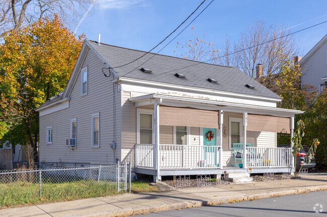 Single-family homes in Downtown Woonsocket with a front porch.