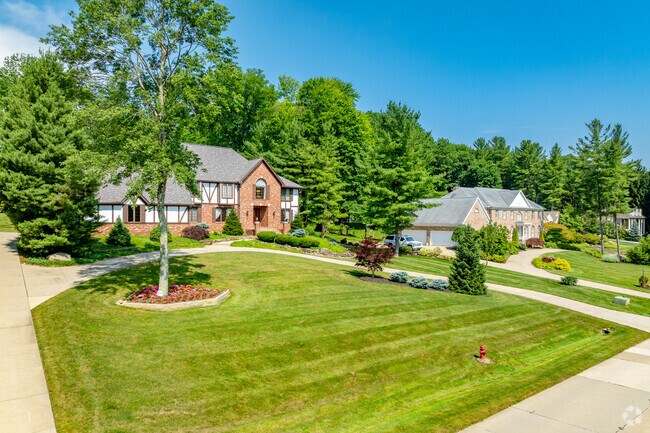 Montrose-Ghent properties feature spacious green lawns and mature trees.