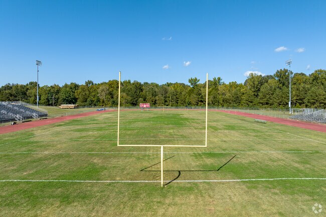 Locals cheer their team on at the football field at Byhalia High School.