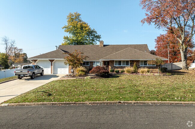 The ranch homes in Forsythia Gate feature large front yards and two-car garages.
