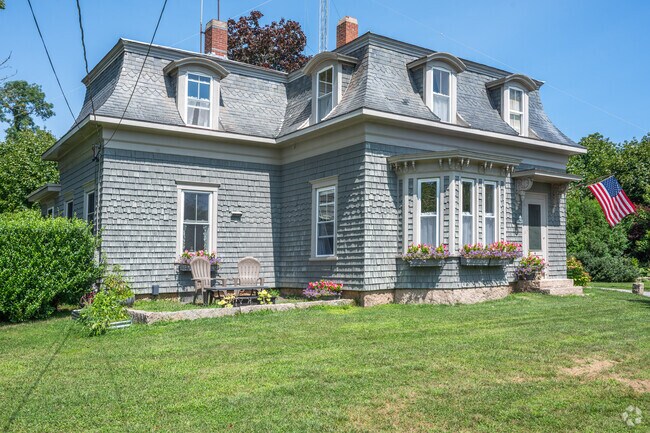 The slate roof of this victorian style home make it stand out from other West Falmouth houses.
