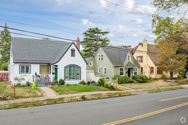 A set of english cottages vary in size and color in the Northeast Neighbors neighborhood.