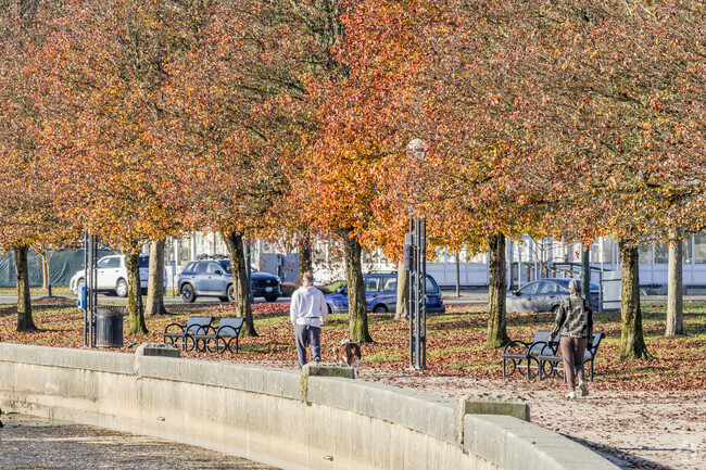 Locals walk the colorful pathway that lines the water in downtown Olympia Heritage Park.