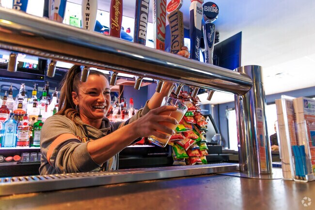 The bartender at Asil's Pub in Fairmount is more than happy to pour you a drink.