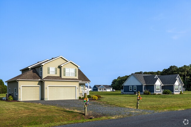 New construction homes on acreage near Atlantic combine modern comfort with tranquil views, some even featuring private waterfront access.