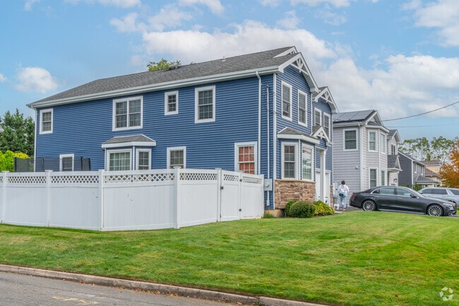 Classic home styles with contemporary features are sprouting up across Locust Valley.