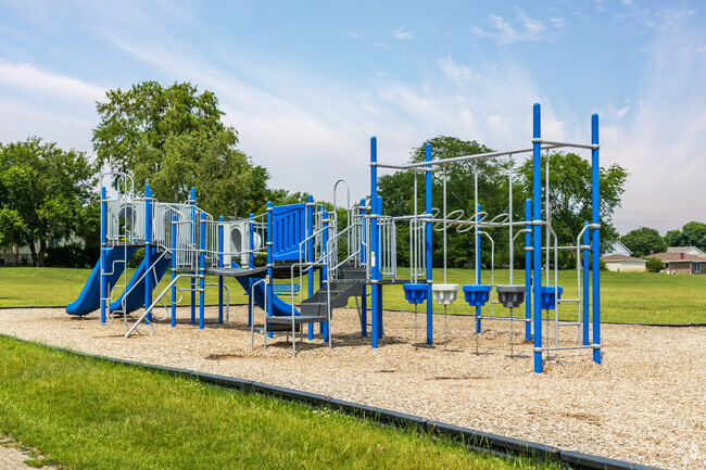 The school grounds include a modern playground.