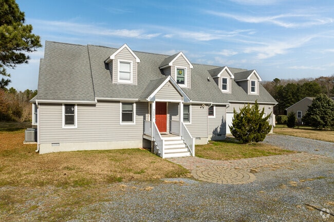 Many Cape Cod homes can be found in Millville including this extended version with dormers.
