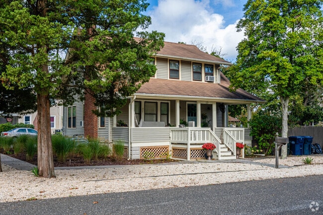 Some colonial homes have large porches in Beachwood, NJ.