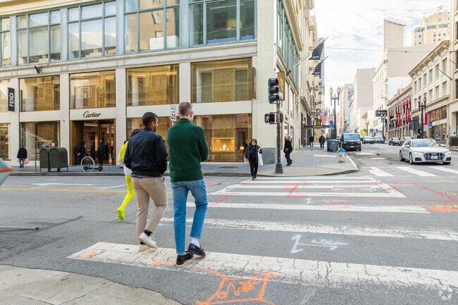 Sidewalks Downtown are crowded with people on their way to or from work.