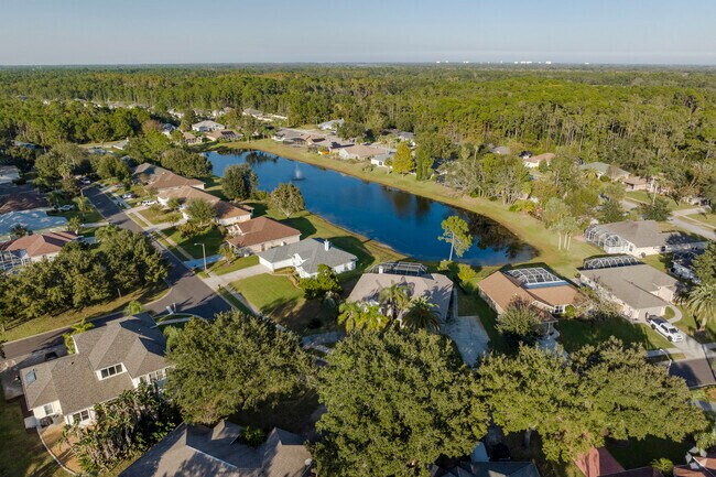 The Pine Trails neighborhood in Florida is situated amongst lush trees and ample waterways.