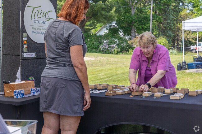 South Boardman residents enjoy visiting the Torch Lake Whitefish Fest Art Show.
