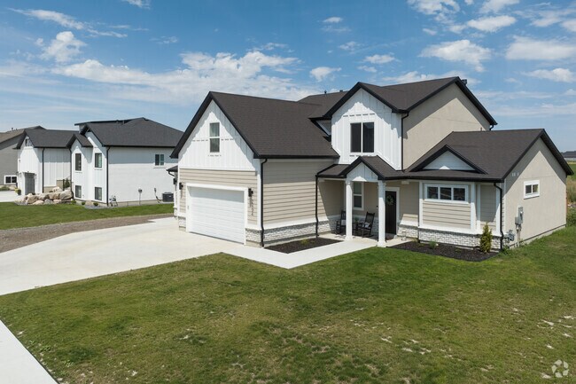 Sidewalk-lined Farr West subdivisions invite evening walks and stroller laps.