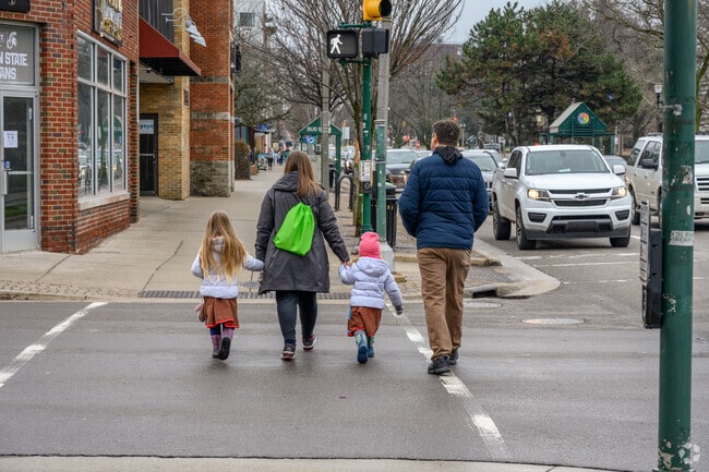 A family spends the afternoon enjoying the stores of Downtown East Lansing.