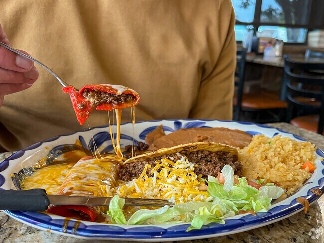 Try the Tex-Mex plate at El Mexicano.  It's delicious.