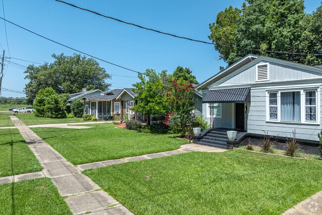 Garden District features many bungalow-style homes with well-maintained lawns.