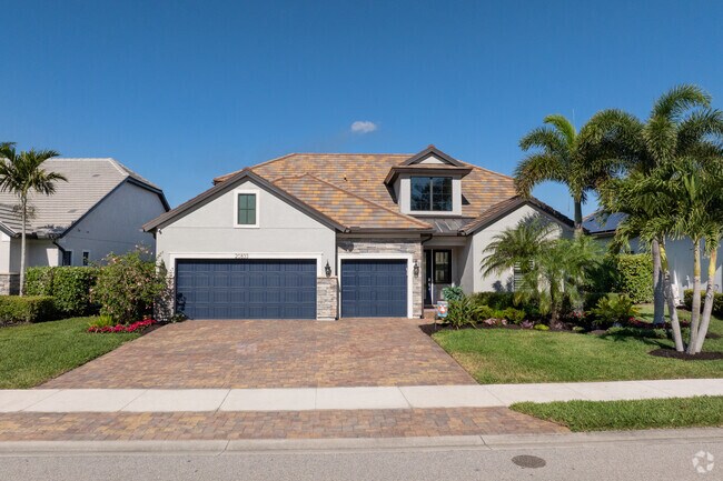 Contemporary homes with personal touches line the shores of the lakes in Corkscrew Shores.