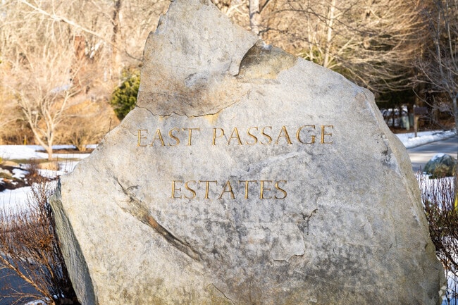Spot the East Passage Estates rock sign and enjoy a neighborhood with water views and more.
