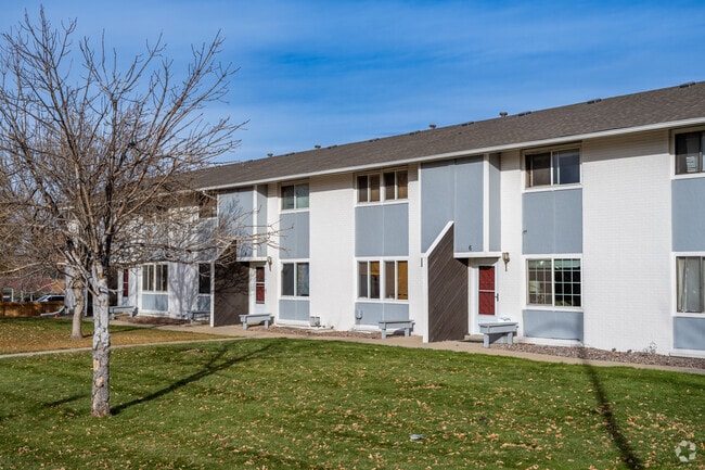 Apartments with fresh green front lawns in Greenway Park, Broomfield, Colorado.