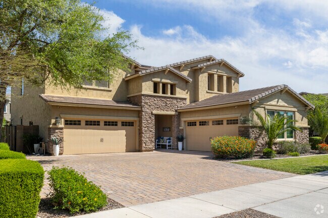 Larger Spanish style homes in Queen Creek can have 4 car garages.