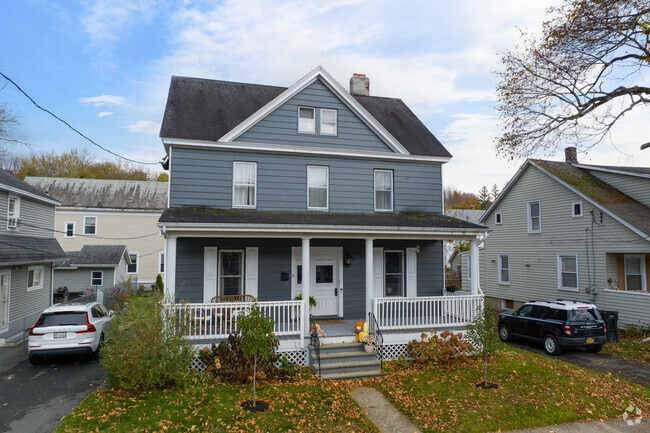 Sycaway homes feature welcoming porches and maintained lawns.