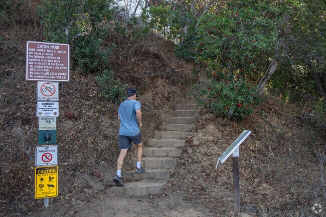 A man runs up an entrance to Eaton Park.