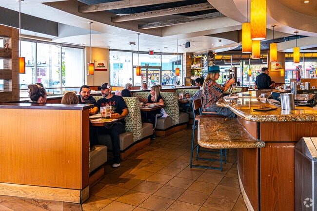 Grand locals enjoy California Pizza Kitchen in the Riverside Plaza.