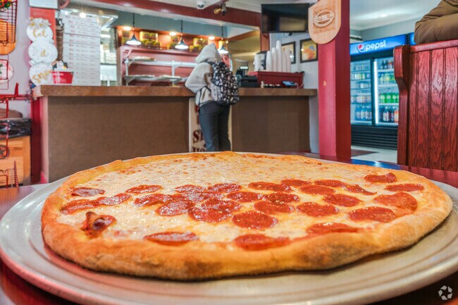 For a fresh slice and a soda, locals head to Mike's Brick Oven Pizza in Beech-Wilson.