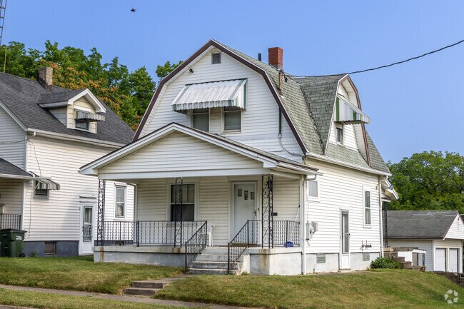 This Highview Hills home features a classic design with a hip roof.