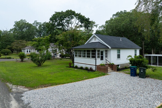 Surrounded by trees and lawn, this Elwood home is minutes from local shops and schools along White Horse Pike.