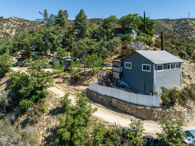 A ranch-style home sits on a hill in Lake Hughes.