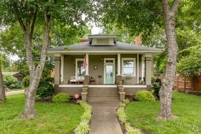 Old growth trees offer shade to owners and others exploring the Green Park area.