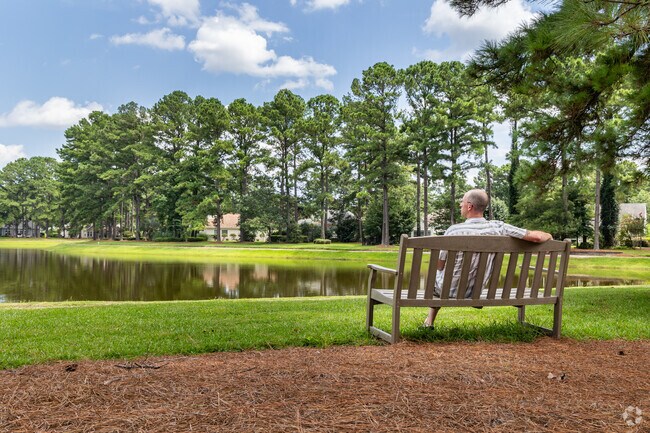 Eagle Pointe residents can enjoy relaxing alongside the neighborhood lagoon.