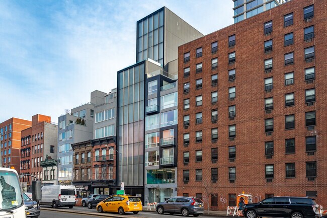 New construction completed on 255 Bowery with floor to ceiling glass styling.