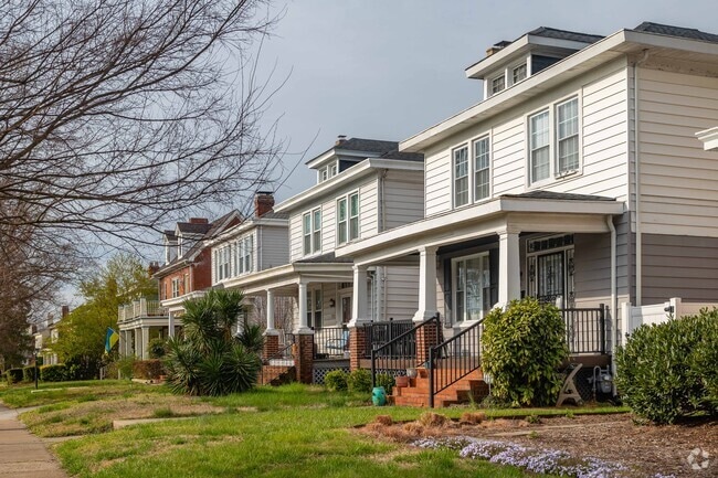 Residents explore streets lined with classic American Foursquare homes in Virginia Union.