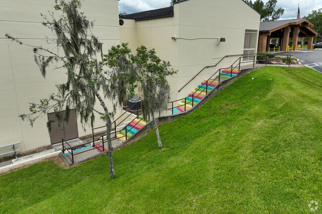 Blessed Trinity School in Southeast Ocala, FL has a rainbow staircase that leads to the side.