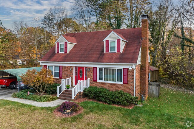 In The Village, a Cape Cod style home stands out with its striking red accents.