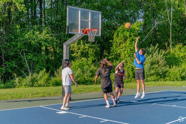Local kids enjoy a basketball game at East Village Park in Shelton.