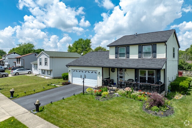Dwellings, sit along curving sidewalk-lined streets that often spread into cul-de-sacs.