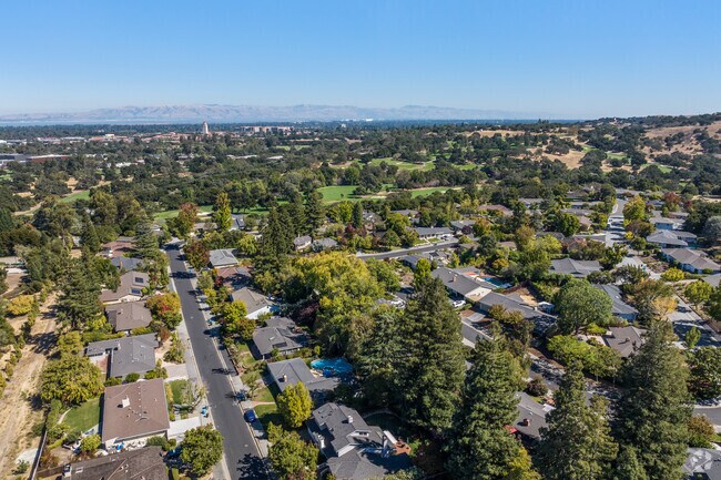 Lush greenery surrounds the peaceful Stanford Hills, with views of nearby Stanford University.