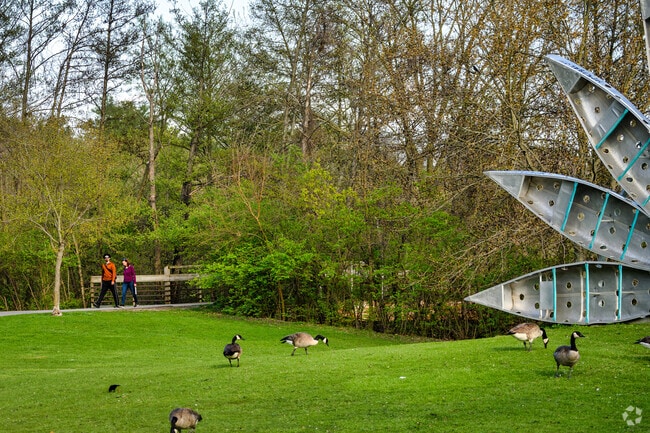 A couple walks along the quiet pathways of Gallop Park, close to Tuomy Hills.
