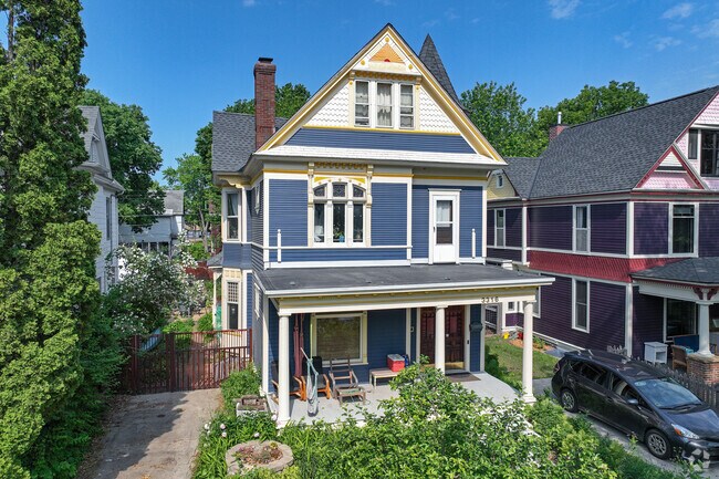 Historic Queen Anne-style homes can be found overlooking the scenery of Powderhorn Park.