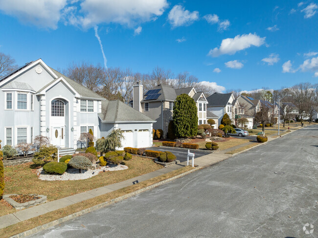 Streets lines with newer custom built homes can be found in Land of Pines.