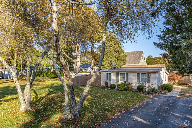 Several West Island homes pair beach-inspired designs with leafy, shaded yards.